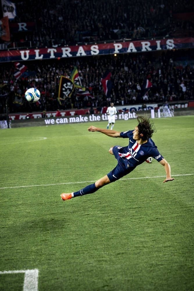 This may contain: a soccer player is diving for the ball