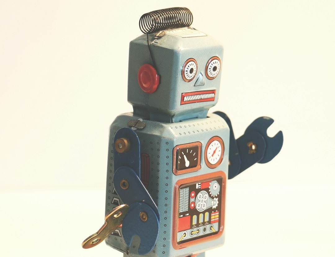 gray and orange plastic robot toy