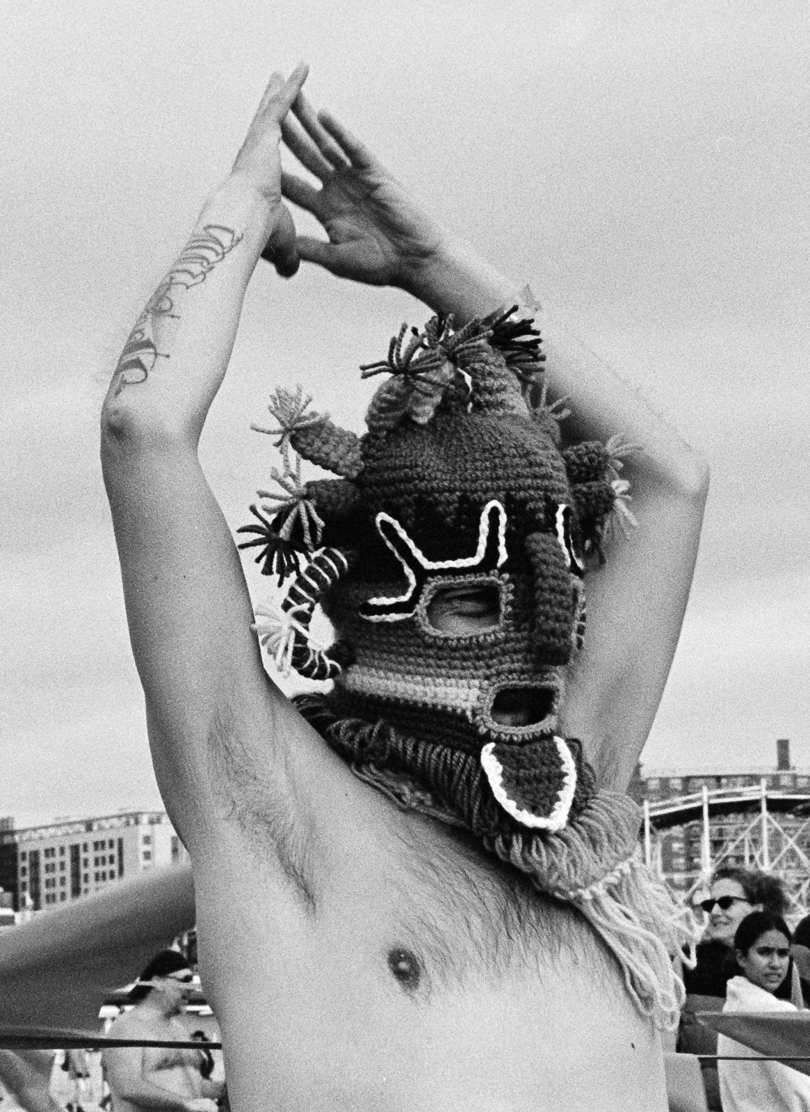 Man wearing wool knit mask covering entire face. 