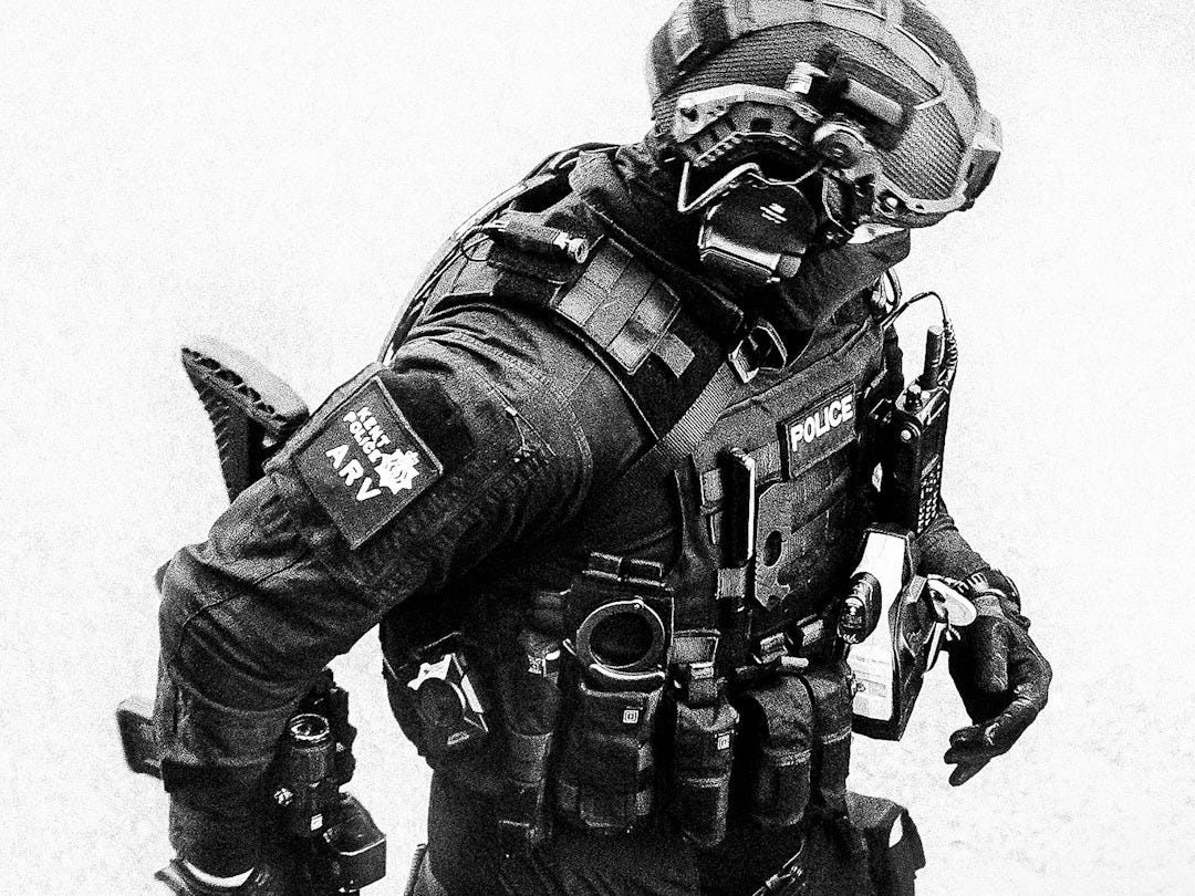 a black and white photo of a man in a military uniform a black and white photo of a man in a military uniform