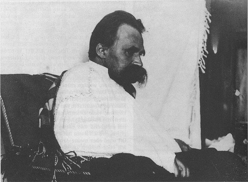 A person with a beard sitting on a chair

AI-generated content may be incorrect.