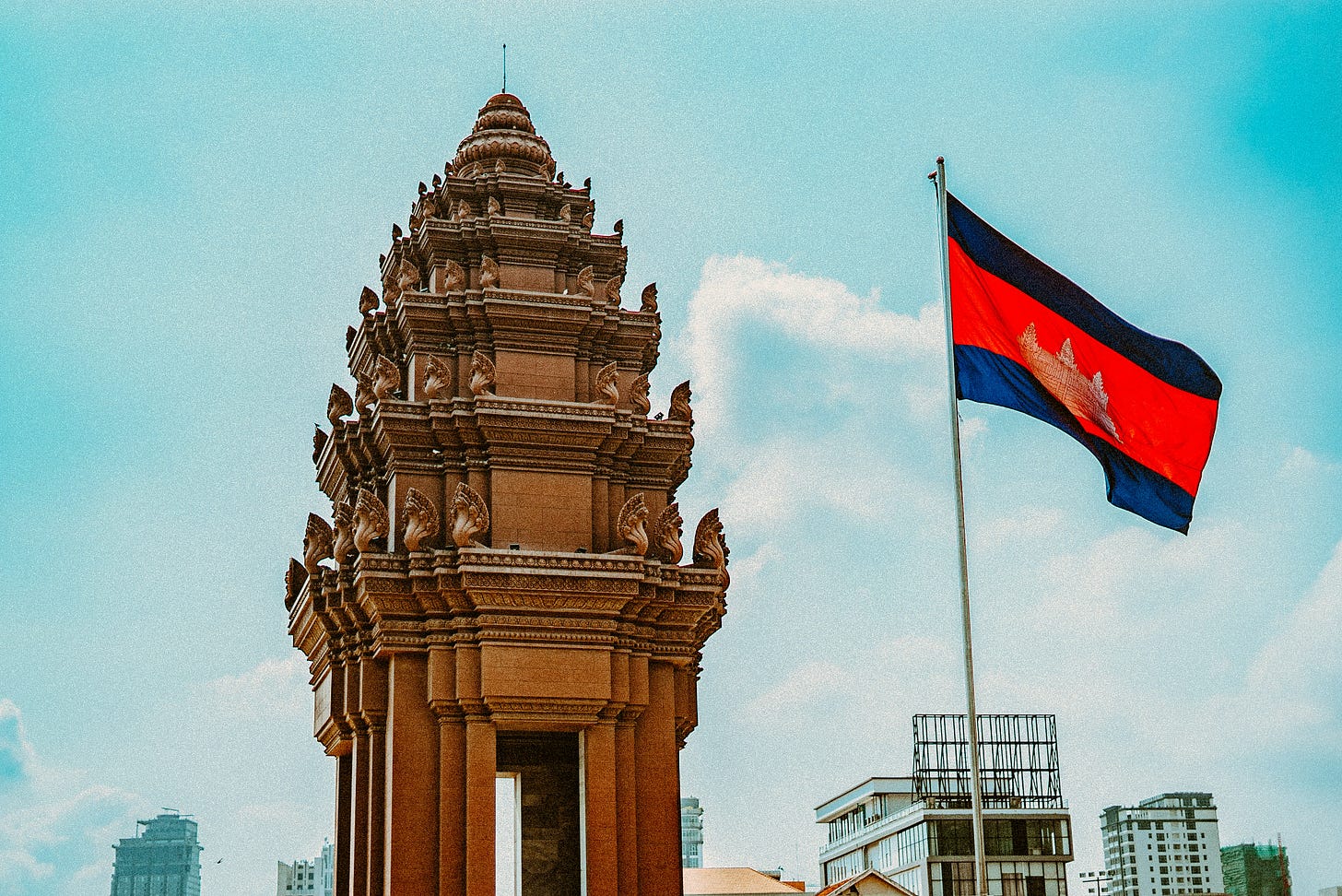 Cambodian flag and Khmer architectural monument marking Cambodia’s 33rd Constitution Day. Cambodian flag and Khmer architectural monument marking Cambodia’s 33rd Constitution Day.