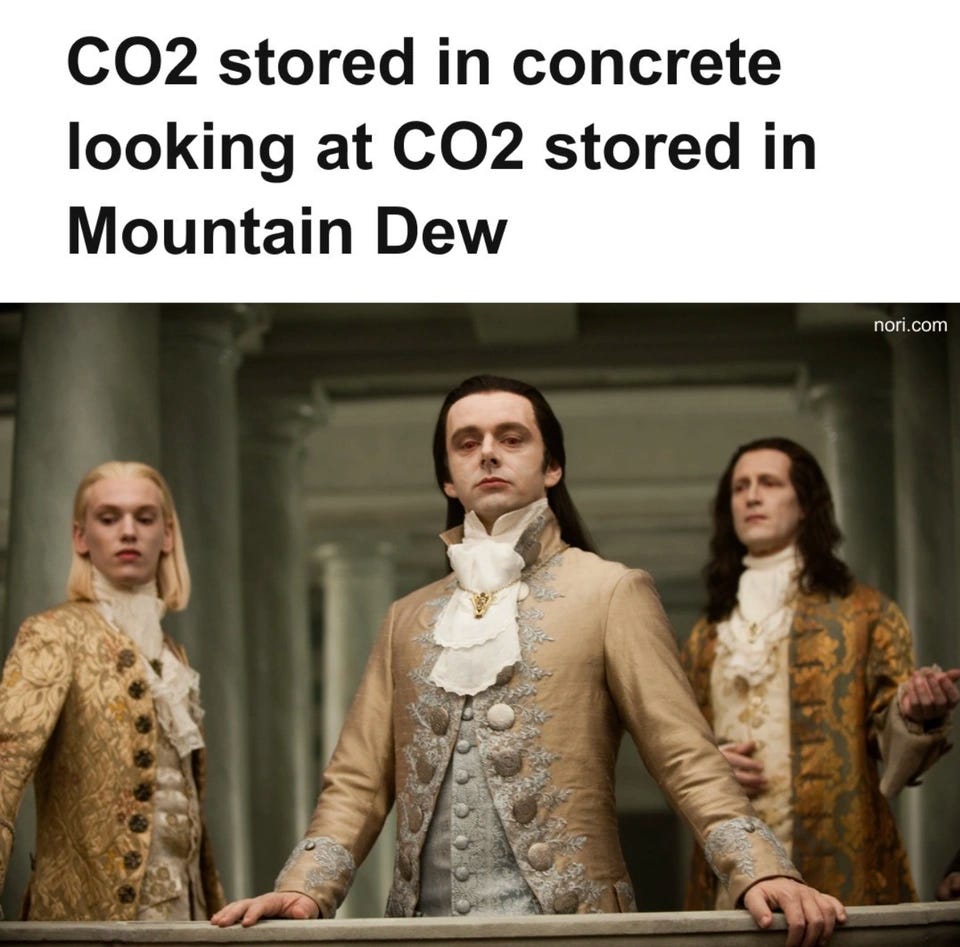 Meme headed "CO2 stored in concrete looking at CO2 stored in Mountain Dew". Below, three pale vampires of the Volturi from Twilight, in eighteenth-century coats and lace cravats, gaze down haughtily from a balcony.