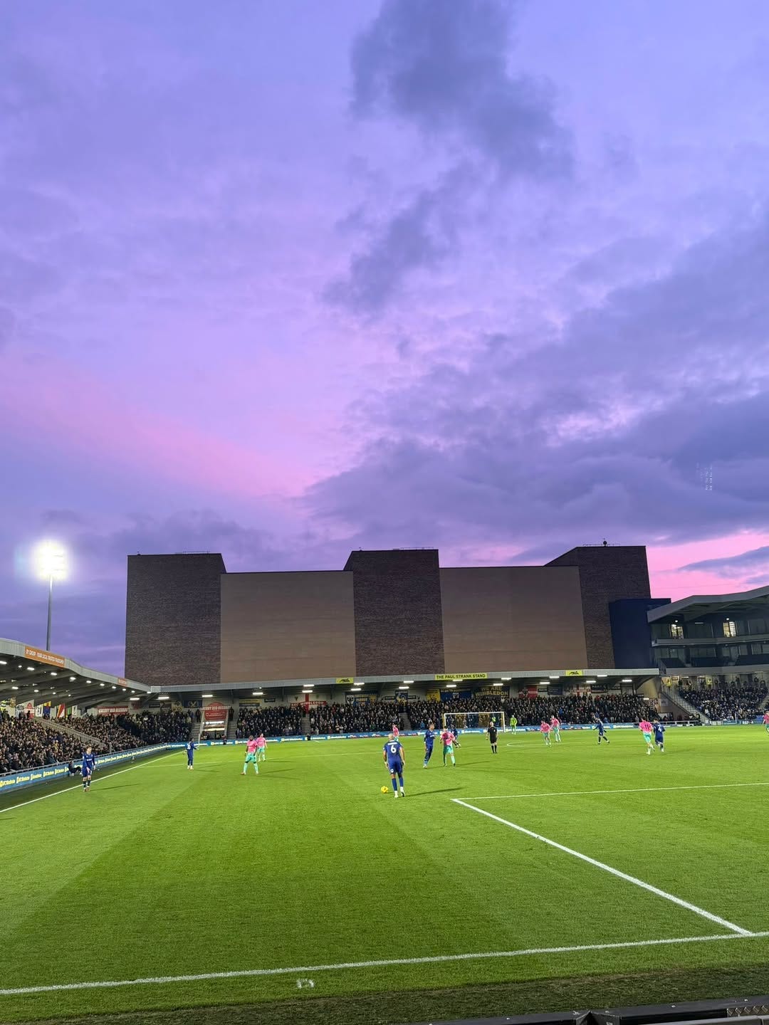 May be an image of football and twilight