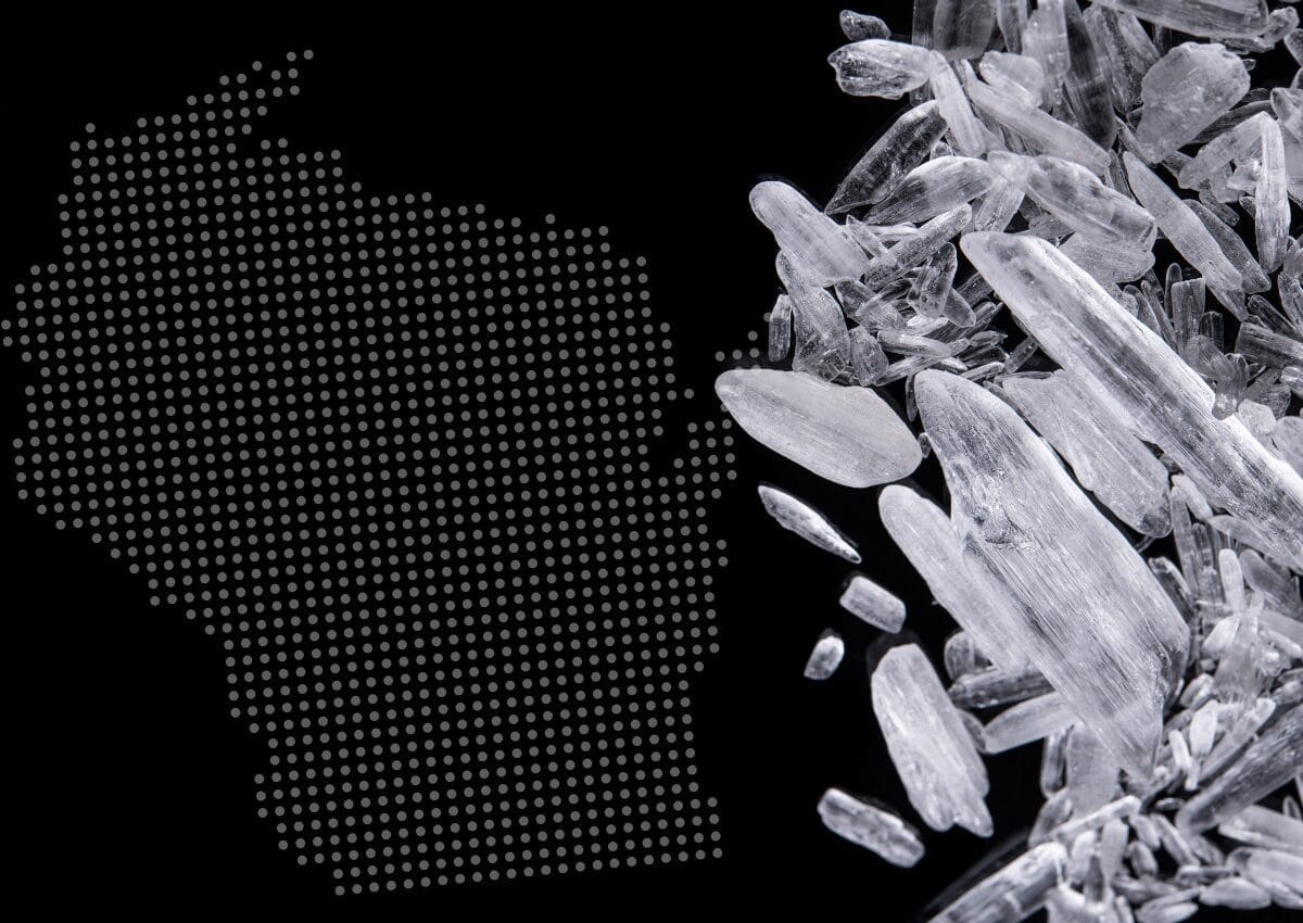 Graphic with the outline of the state of Wisconsin next to methamphetamine crystals Graphic with the outline of the state of Wisconsin next to methamphetamine crystals