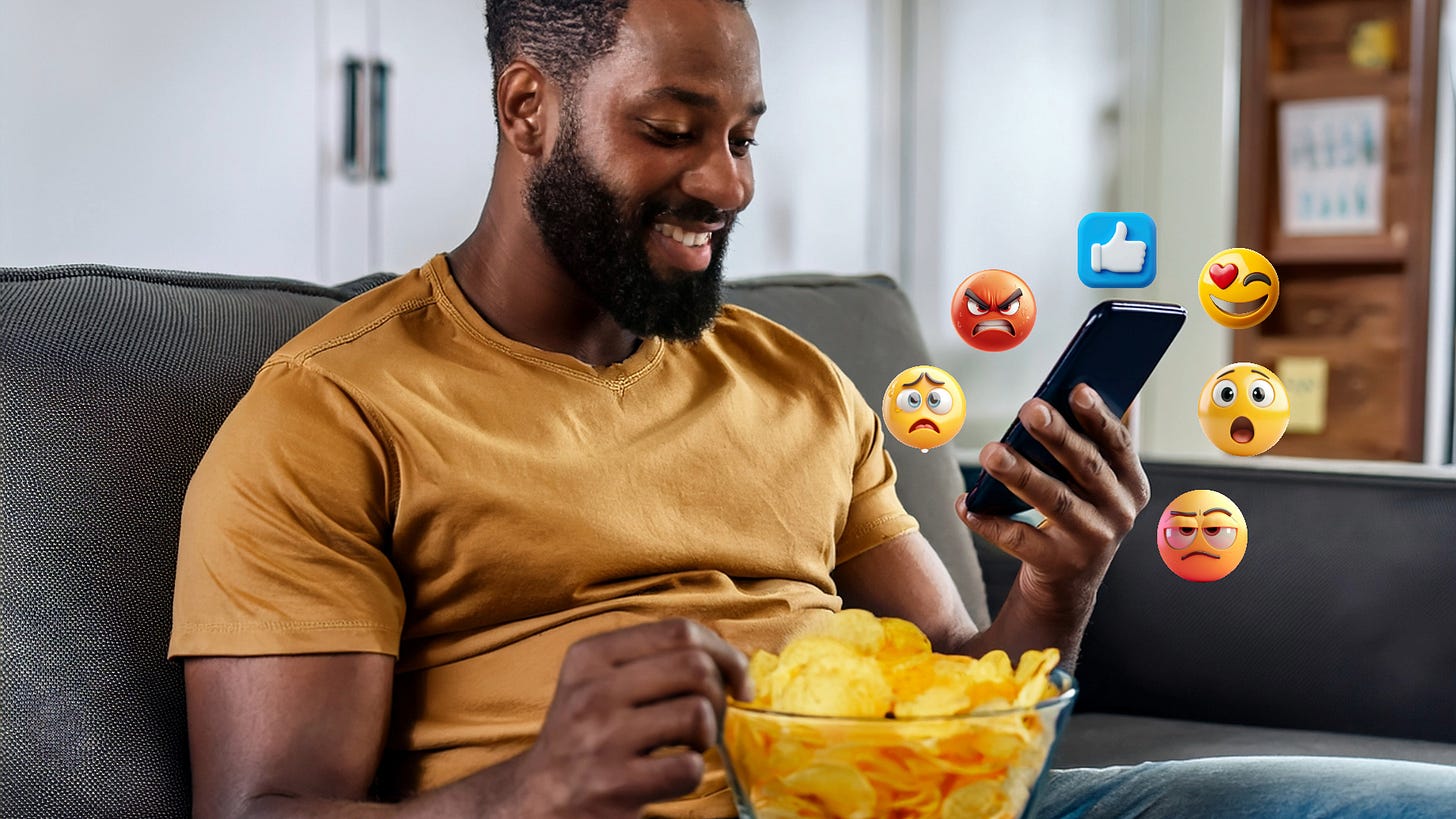 A Black man in a yellow T-shirts sits on the couch eating potato chips while scrolling through social media on his phone. Emojis float around his phone.
