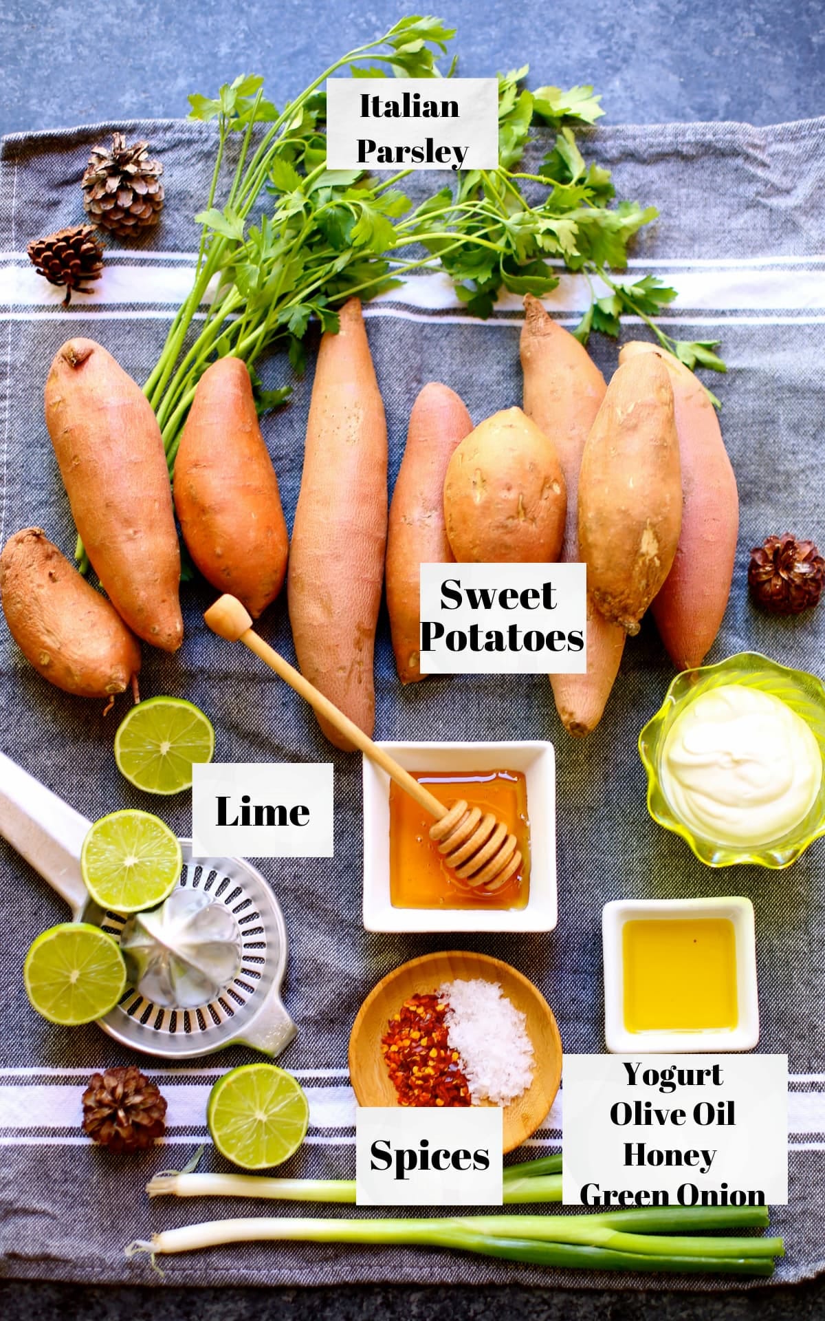 a table of ingredients, sweet potatoes, olive oil, lime, honey, soices and italian parsley.  
