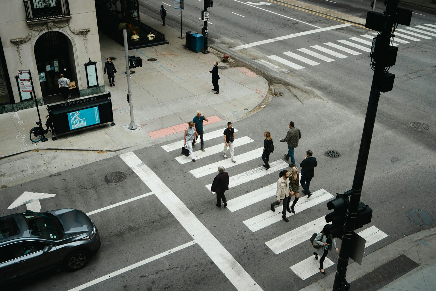 People Walking on a Pedestrian Lane · Free Stock Photo