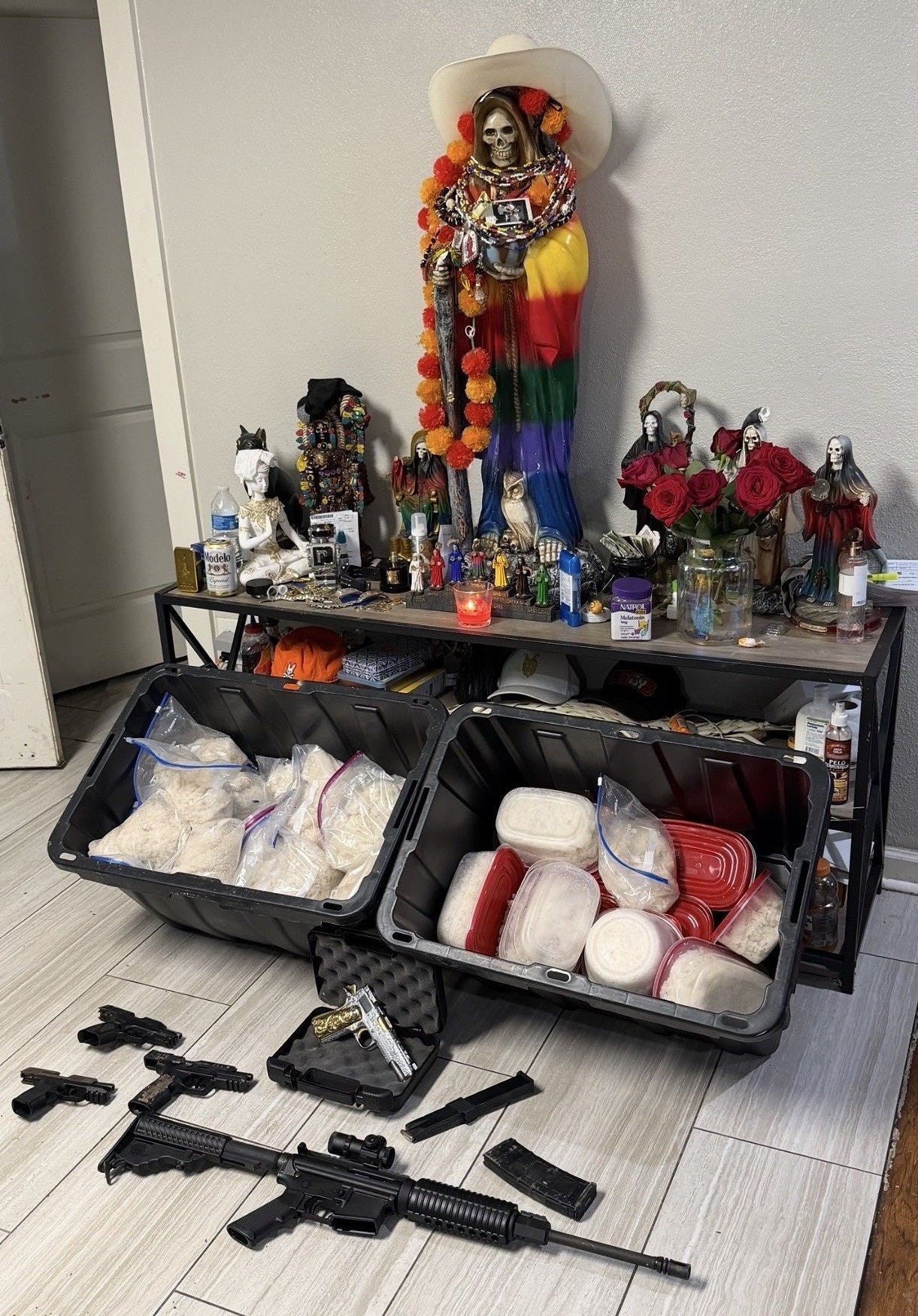 Law enforcement officers from four different agencies discovered this elaborate “Santa Muerte” shrine when they seized meth, guns, and ammo in Houston on May 14, 2026 (Houston Police Department photo) Law enforcement officers from four different agencies discovered this elaborate “Santa Muerte” shrine when they seized meth, guns, and ammo in Houston on May 14, 2026 (Houston Police Department photo)