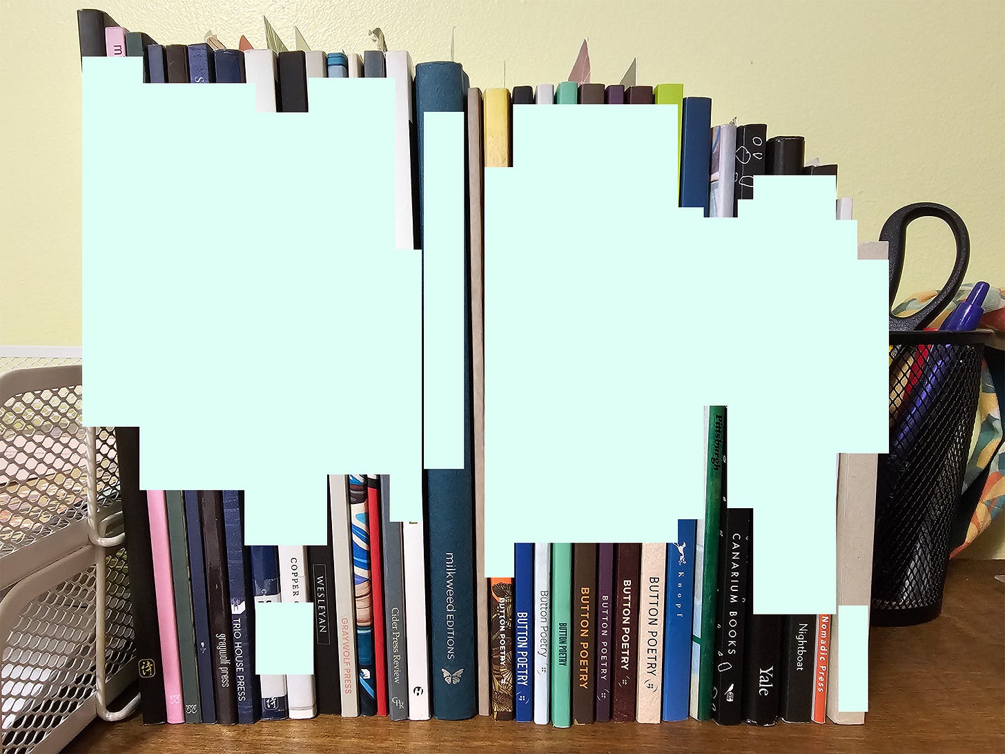 Photograph of 31 poetry books on top of a bookshelf. The authors and titles are edited out of the photo, but on most of them the publisher's imprint is visible. Some books have bookmarks in them.