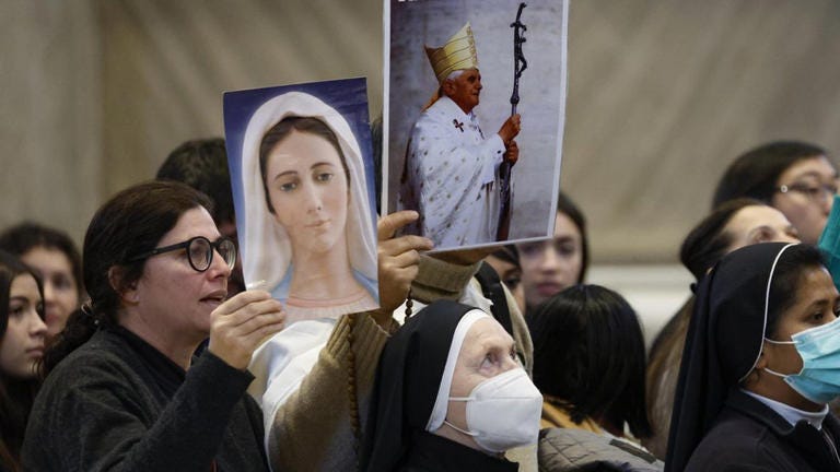 Benedict XVI's body lay in state in St Peter's Basilica for public viewing