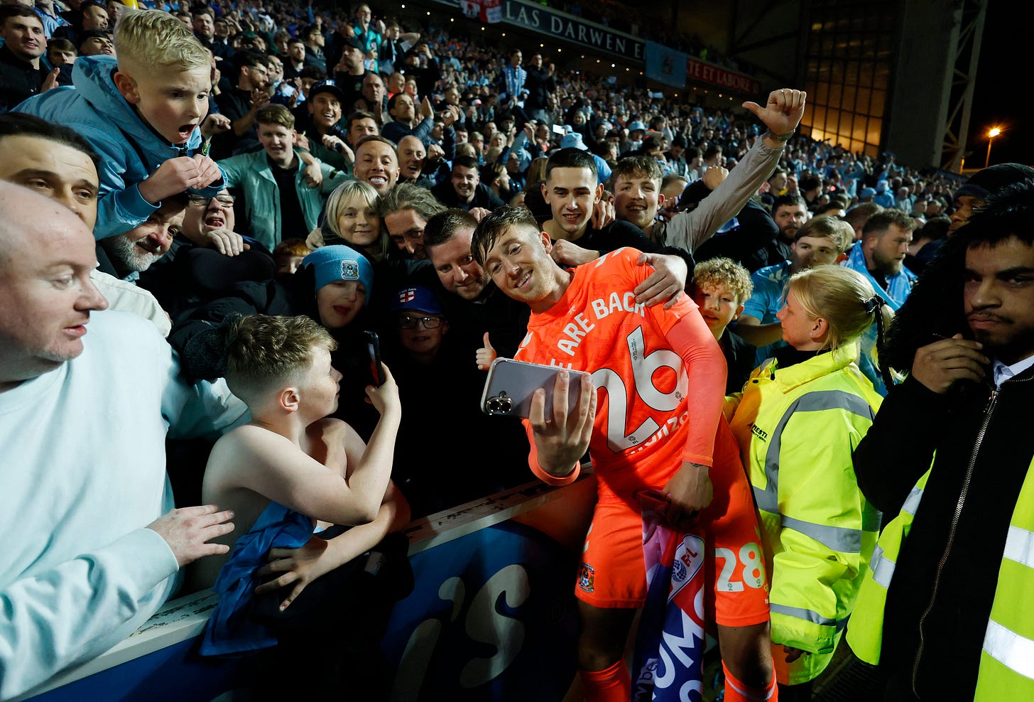 Coventry City's Josh Eccles takes a selfie with fans