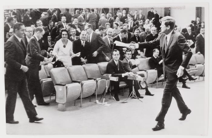 President John F. Kennedy leaving the auditorium after a press conference,  Washington, D.C.] | 1International Center of Photography