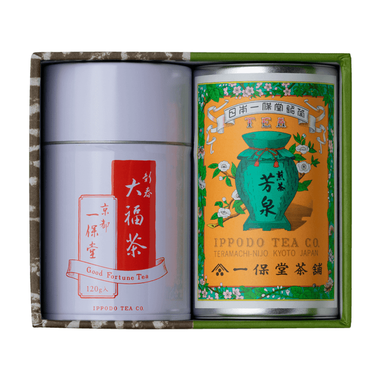 Green and brown box containing two tea canisters one colorful and one red and white label