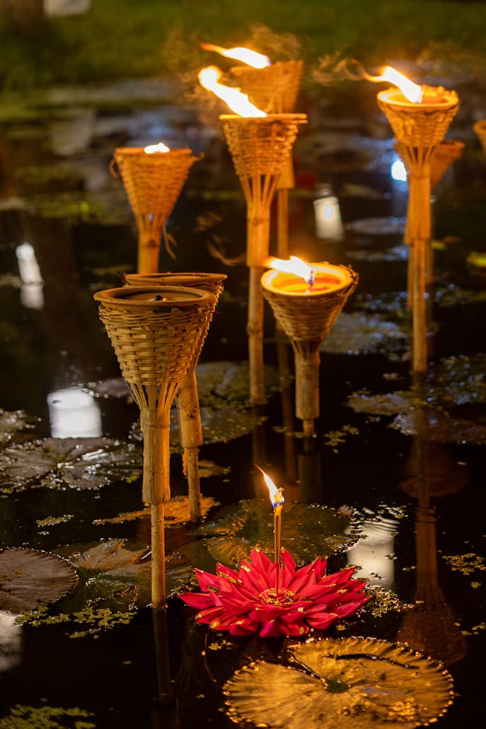 While Yi Peng illuminates the sky, Loy Krathong illuminates the rivers, lakes, and canals in Thailand. Throughout the corners of the country, people place candles, flowers, and incense on small floating baskets known as krathong before releasing them into the water. While Yi Peng illuminates the sky, Loy Krathong illuminates the rivers, lakes, and canals in Thailand. Throughout the corners of the country, people place candles, flowers, and incense on small floating baskets known as krathong before releasing them into the water.
