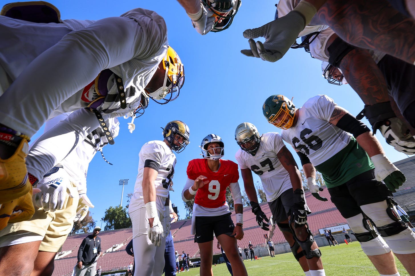 May be an image of 5 people, people playing football and outdoors