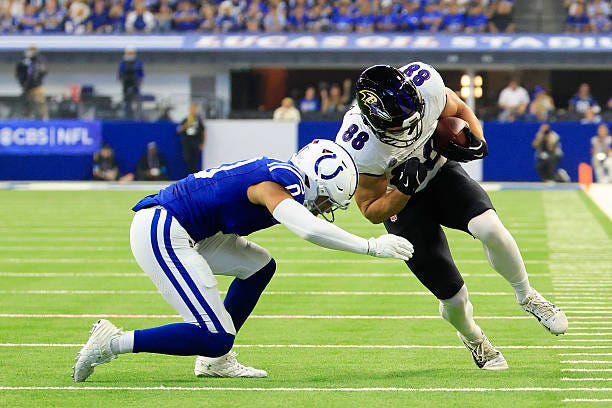 Matthew Hibner of the Baltimore Ravens is tackled by Cam Bynum of the Indianapolis Colts /during the first half of the game at Lucas Oil Stadium on...