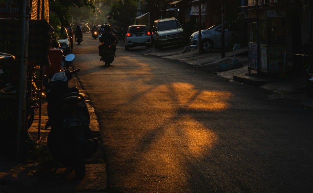cars parked on side of the road during night time