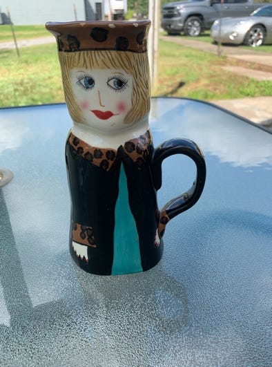 A ceramic mug with a person face

AI-generated content may be incorrect.