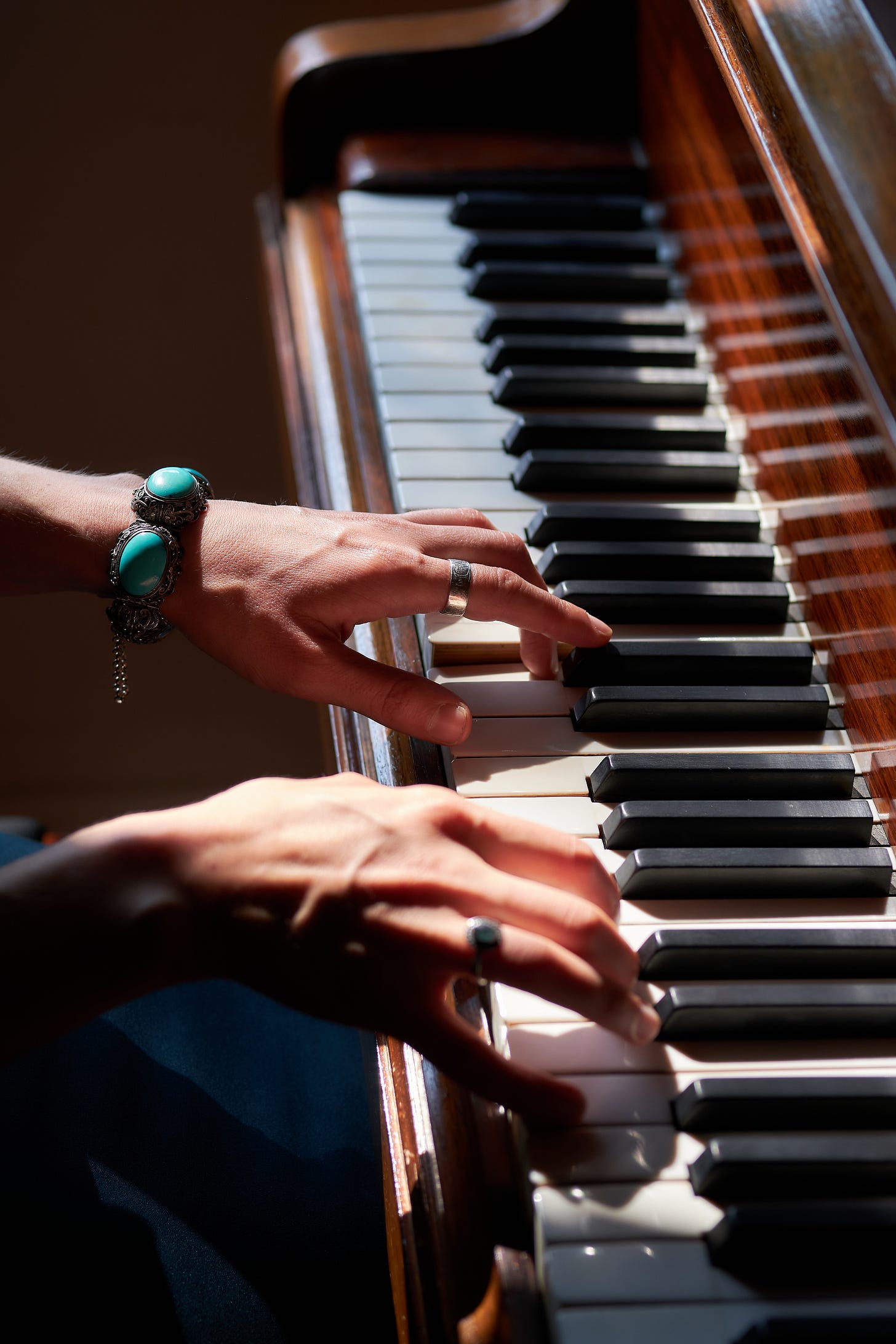 Danielle Styles' hands playing a piano. Danielle Styles' hands playing a piano.