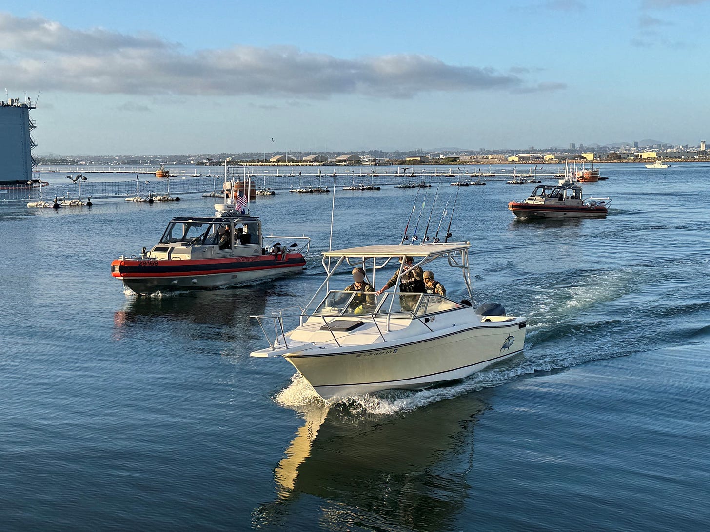 A human smuggling vessel intercepted by the US Coast Guard, despite its disguise as a “fishing boat,” is escorted into the San Diego harbor. (US Coast Guard photo) A human smuggling vessel intercepted by the US Coast Guard, despite its disguise as a “fishing boat,” is escorted into the San Diego harbor. (US Coast Guard photo)