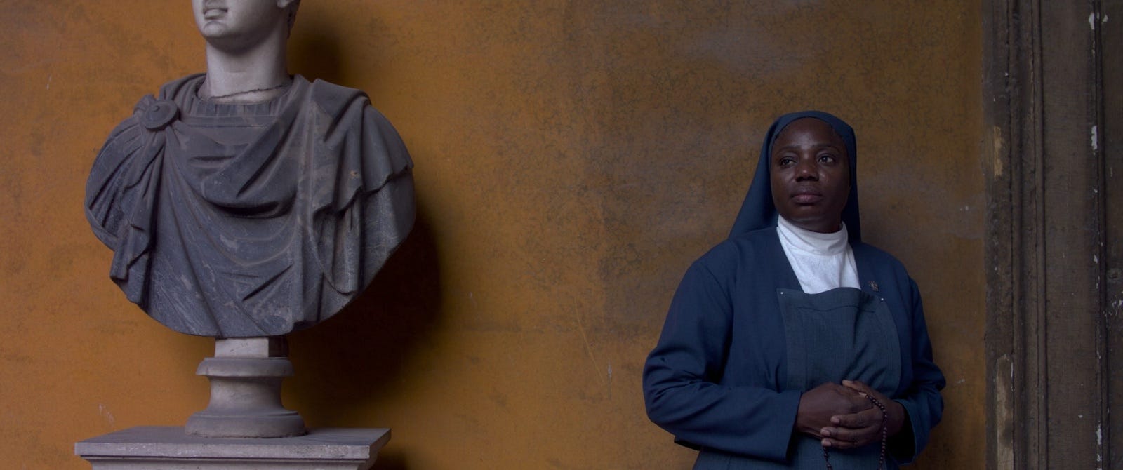 Screenshot from "Conclave." Sister Shanumi looks away pensively.