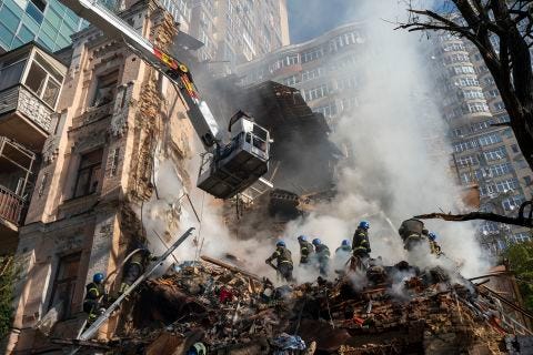 Firefighters work on a building in Kyiv, Ukraine, on October 17, after a Russian drone attack. Firefighters work on a building in Kyiv, Ukraine, on October 17, after a Russian drone attack.