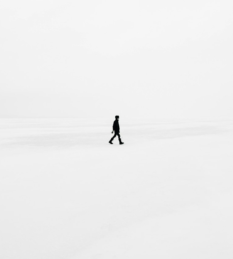 person walking on snowfield