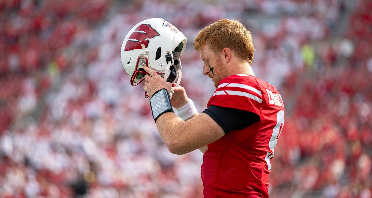 Wisconsin quarterback Billy Edwards Jr. putting on his helmet Wisconsin quarterback Billy Edwards Jr. putting on his helmet