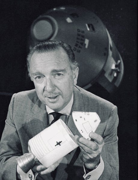 Walter Cronkite of CBS News holds a model of the Apollo Command and Service Modules. (Credit: unknown) Walter Cronkite of CBS News holds a model of the Apollo Command and Service Modules. (Credit: unknown)