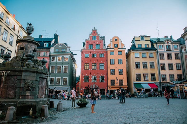 Charming church and mulit-colored row houses in historic Stockholm.