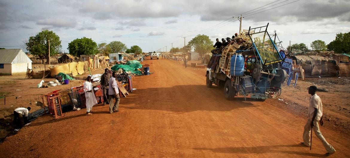 A patrol of UN peacekeepers passes through Abyei, a disputed border town between Sudan and South Sudan, where looted items are being collected after recent violence. A patrol of UN peacekeepers passes through Abyei, a disputed border town between Sudan and South Sudan, where looted items are being collected after recent violence.