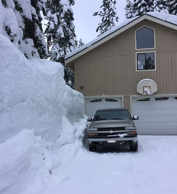driveway with very tall snow banks