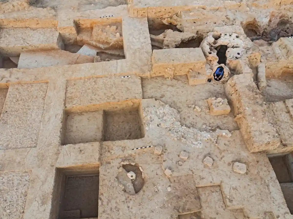 A polished version: **Iron Age potters’ workshop in Area U, viewed eastward, showing the kiln (upper right), working surfaces with stone- and pebble-paved floors (centre right), flat kurkar stones, and a potter’s wheel. Credit: Assaf Peretz, Israel Antiquities Authority.** A polished version: **Iron Age potters’ workshop in Area U, viewed eastward, showing the kiln (upper right), working surfaces with stone- and pebble-paved floors (centre right), flat kurkar stones, and a potter’s wheel. Credit: Assaf Peretz, Israel Antiquities Authority.**