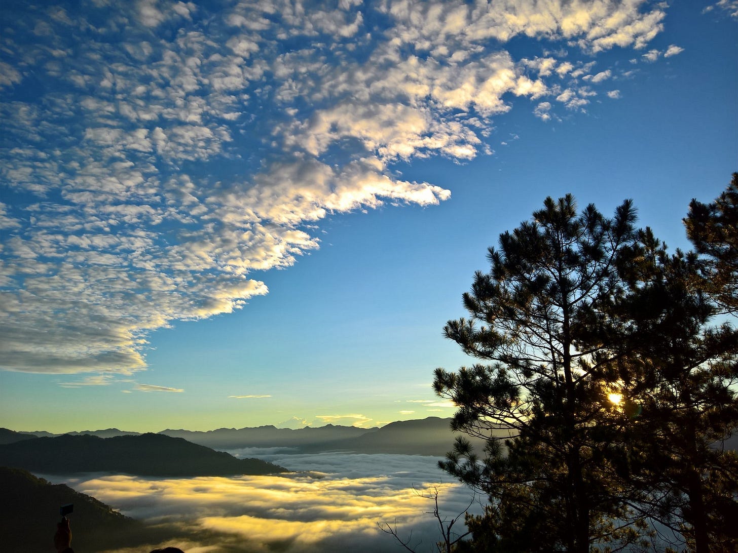Sunrise over Kiltepan Peak transforms the Sagada valleys into a sea of clouds.. Sunrise over Kiltepan Peak transforms the Sagada valleys into a sea of clouds..