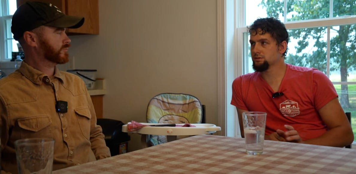 Two men sitting down at dinner table having a discussion. Two men sitting down at dinner table having a discussion.