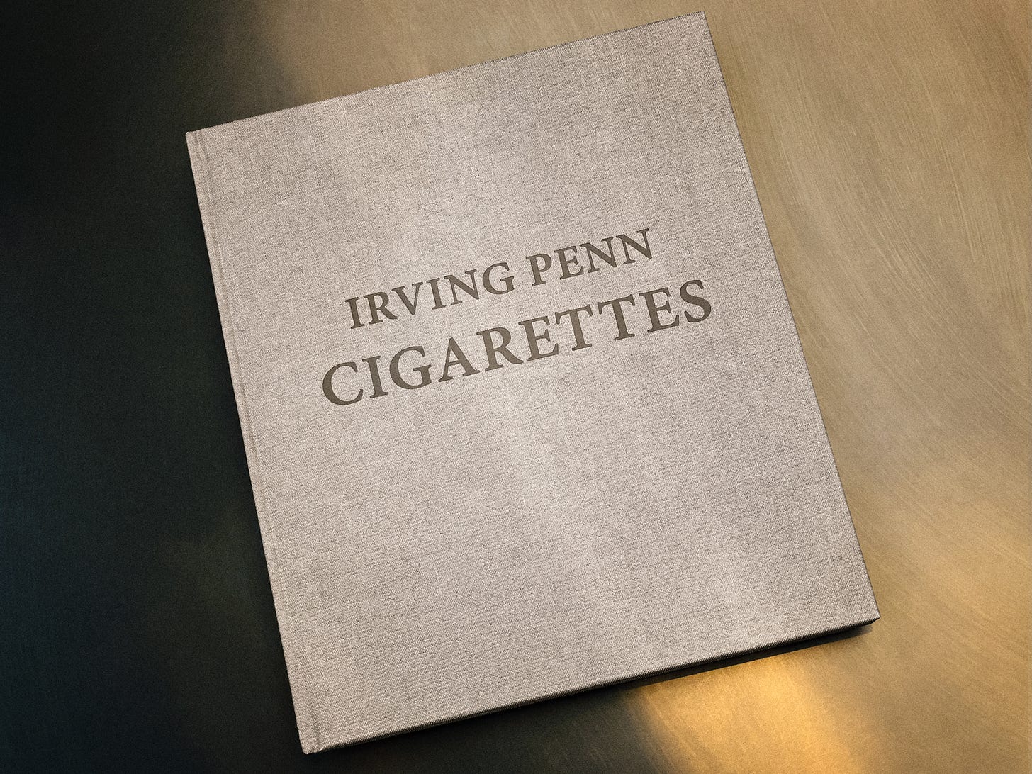 Irving Penn: Cigarettes. Cloth-covered hardback, Hamiltons Gallery, 2012. Debossed title on gray linen. Photograph by Sean Perry.