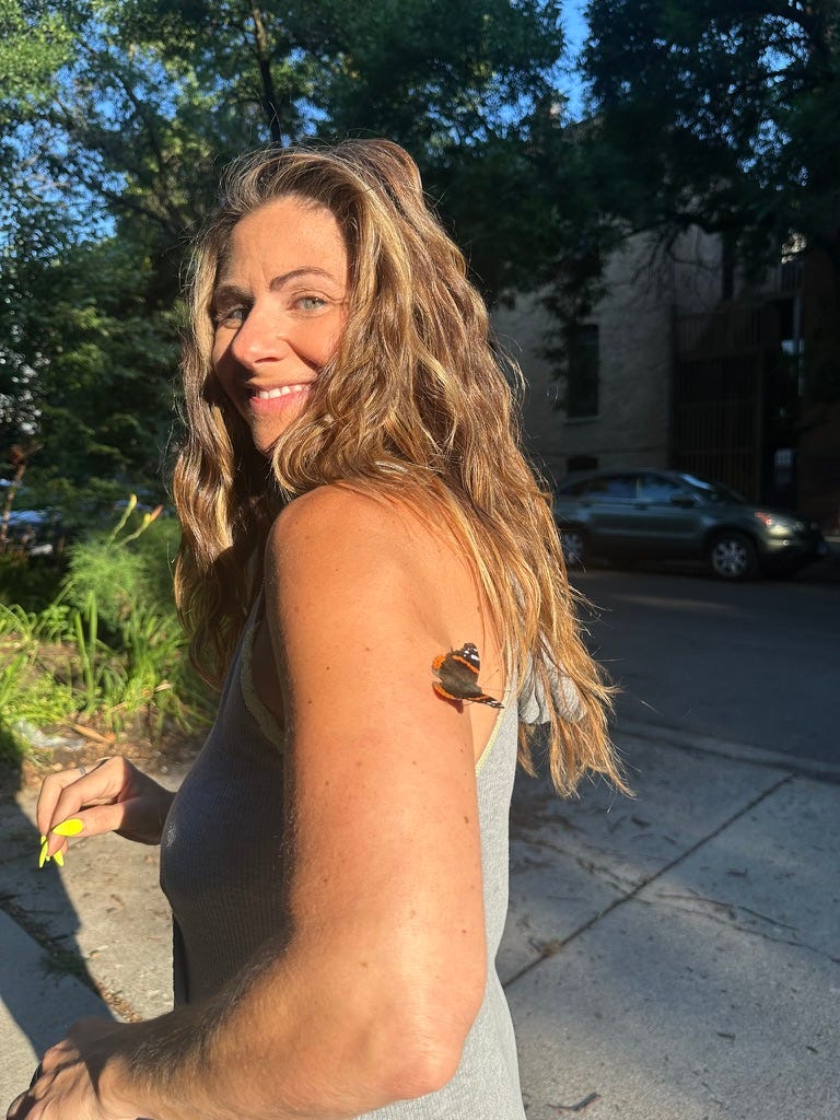 Lucky christina with a butterfly on her arm