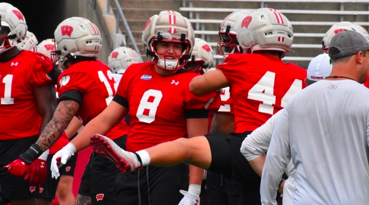 Wisconsin Badgers linebacker Mason Posa warms up during a fall camp practice.