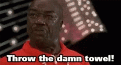 a man in a red shirt is crying and says throw the damn towel