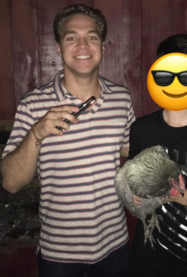 ryan wearing a squeaky clean polo while holding a live chicken during a scavenger hunt ryan wearing a squeaky clean polo while holding a live chicken during a scavenger hunt