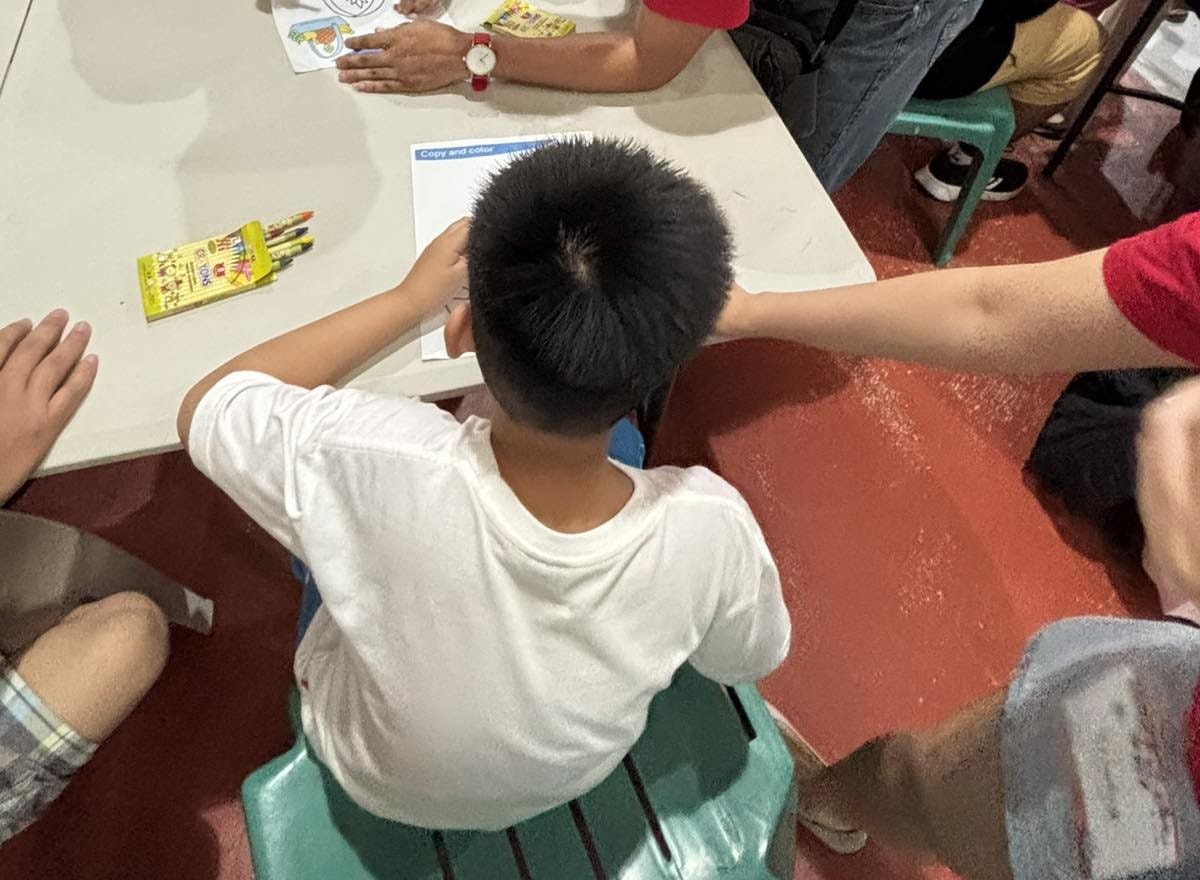 Kuya Miguel during the coloring activity at the National Disability Rights Week