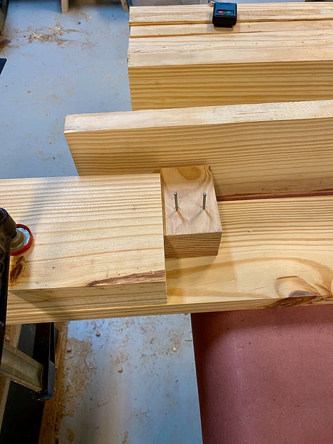 Gluing up the top: Ordering boards, rolling on glue, clamping, a gap opens, trying to close the gap, creating space for a planing stop, more gluing up, popping out the placeholder.