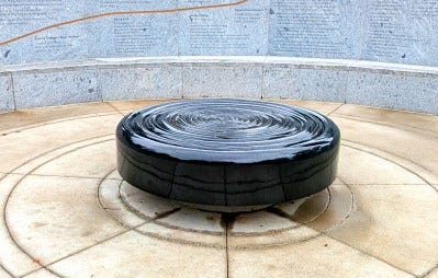 A “prayer millstone” sits at the center of Baltimore County's Covid-19 memorial.