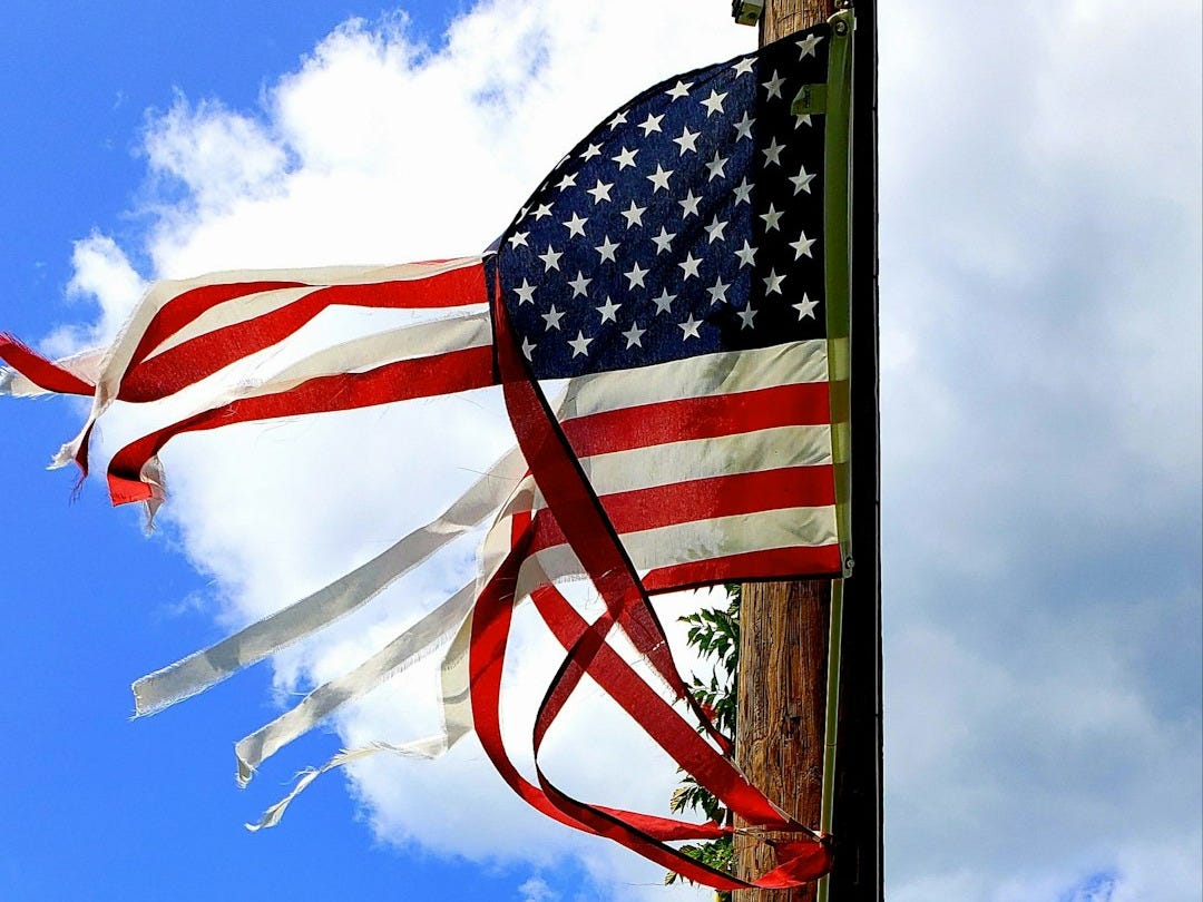 a couple of flags on a pole