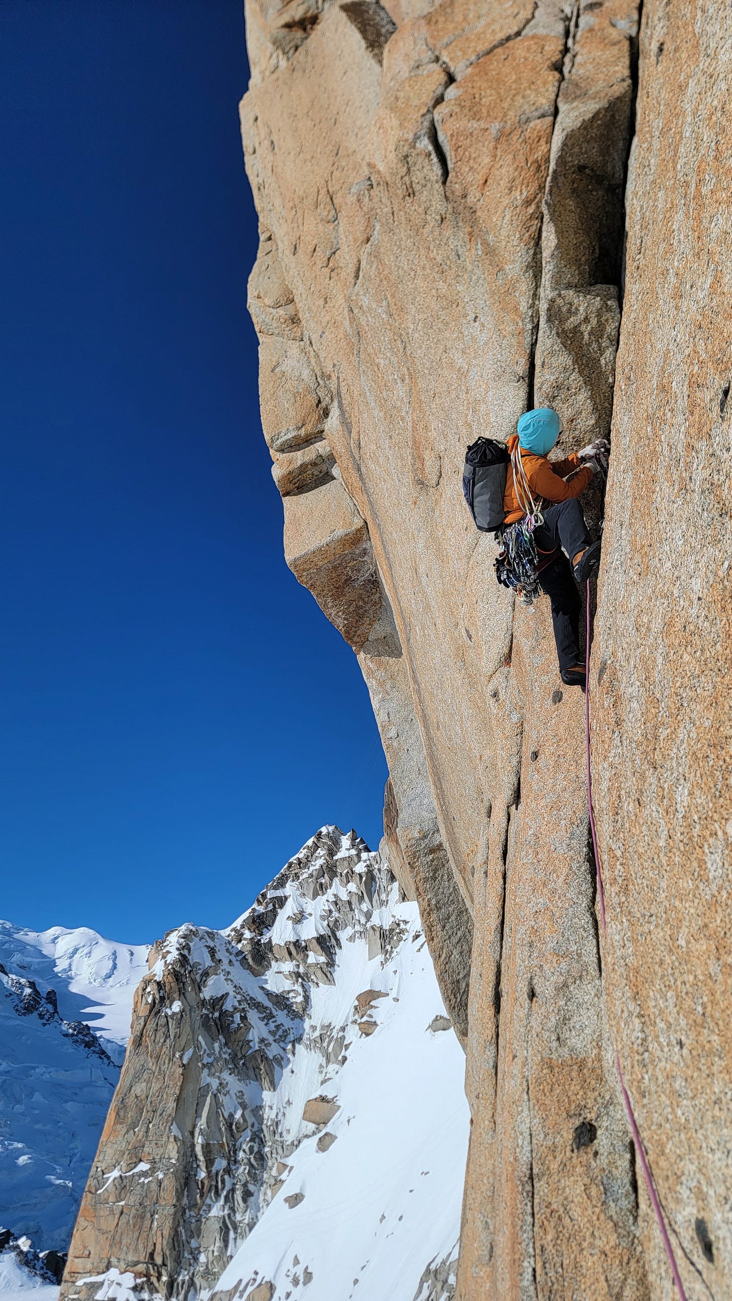 mountain Guide rock climbing the south face of the midi in chamonix