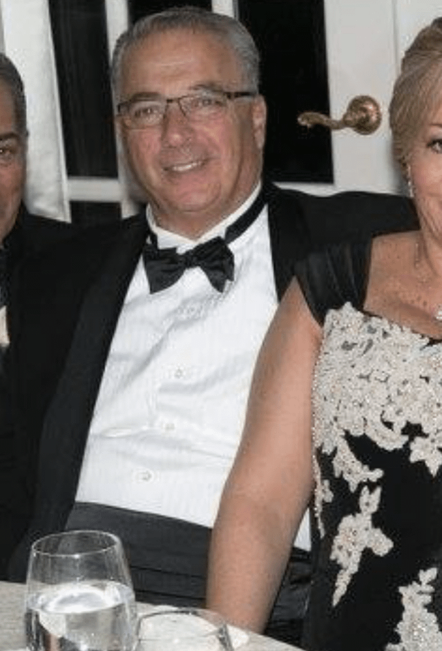 A person in a tuxedo and a person in a dress

Description automatically generated
