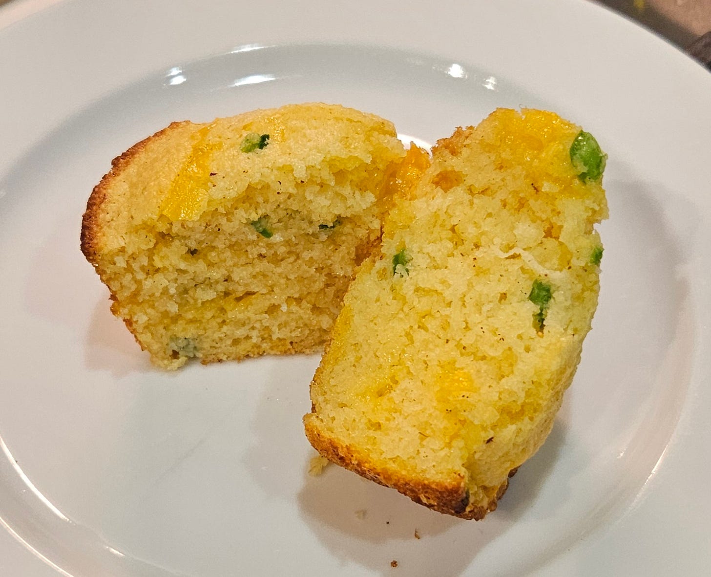 corn bread muffin with jalapenos and cheddar cheese, cut open