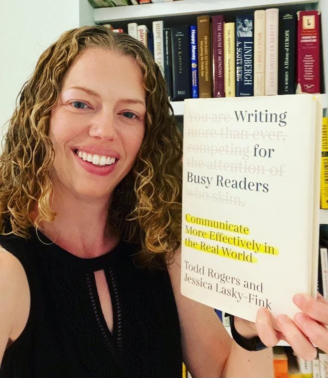 A person holding a book

Description automatically generated