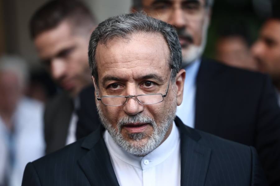 A man in a suit with a beard and glasses